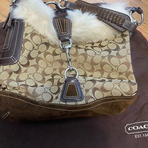 Coach signature handbag with fur lined opening